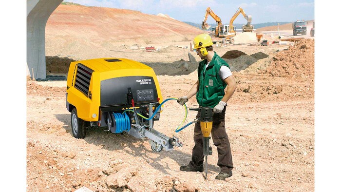 Enrolador de mangueiras para compressores de construção como acessório